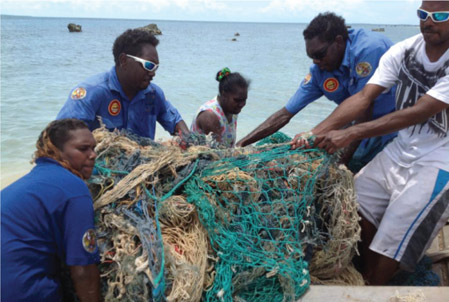 Source 5.1 Anindilyakwa Land and Sea Rangers retrieve a ghost net from the waters surrounding the Groote Eylandt archipelago.