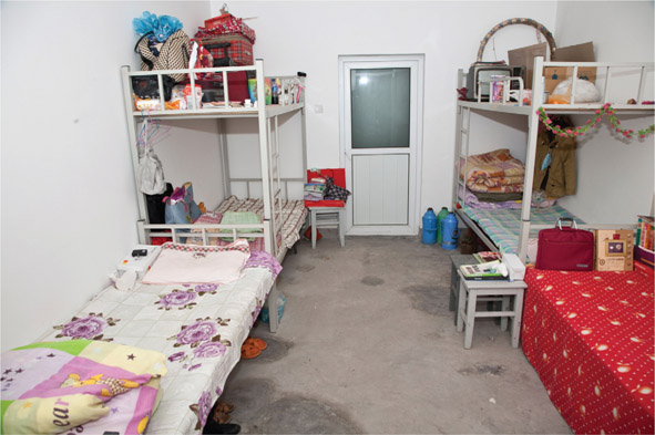 Source 6.14 A dormitory at a factory in Beijing: six workers share this space.