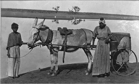 Source 12.20 An Aboriginal girl and woman working as water carters for the Mackay family at Mundabullangana, 1898