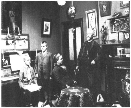 Source 14.26 These photographs show two of the contrasting ways people lived in Australia in 1900. The left shows the rough-and-tumble street life in inner-city Sydney (Wexford Street, near Campbell Street) and the right shows the living room of a well-to-do middle-class family in the Sydney suburbs.